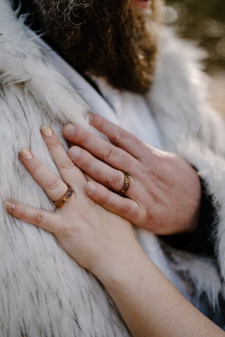 A close up of Matt and Lexi's hands with their new wedding bands.