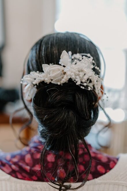 Claire's white hair pin was a delicate touch to her wedding ensemble.
