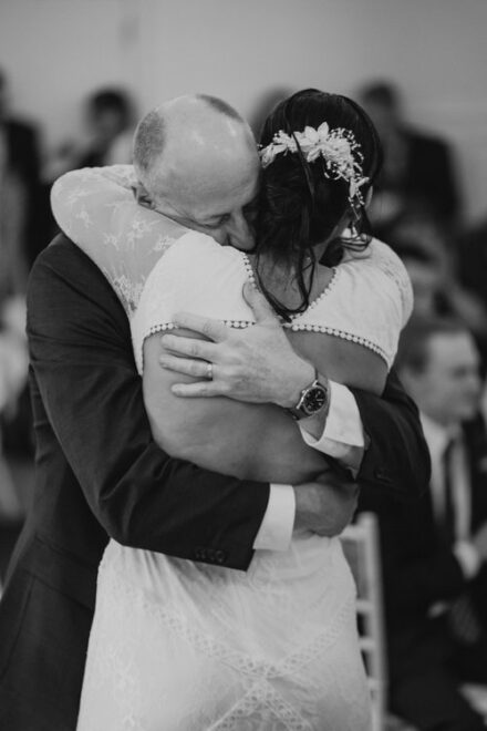 Claire hugs her father after the father/daughter dance.