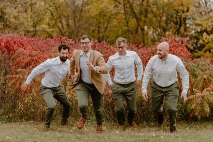 Joe and his groomsmen race toward the camera.