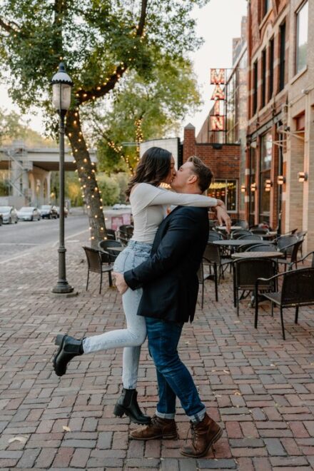 Ehren picks up Ashley in front of the St. Anthony Main Theater as they kiss.