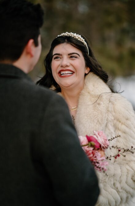 A close up shot of a bride smiling during her elopement ceremony.