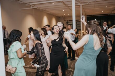 The bride's sisters and bridesmaids dancing during the reception.