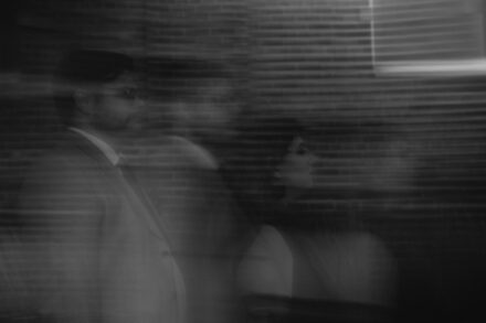 A blurred black and white image of the couple, making them look like ghosts.