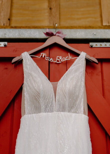 A close up of Anna's wedding dress and hanger that reads "Mrs. Block."