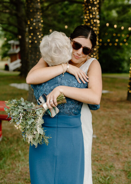 Anna hugs her grandma when she arrives back at the wedding reception.