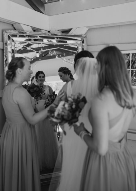 The bridesmaids pray over Anna in the cabin before the wedding ceremony.