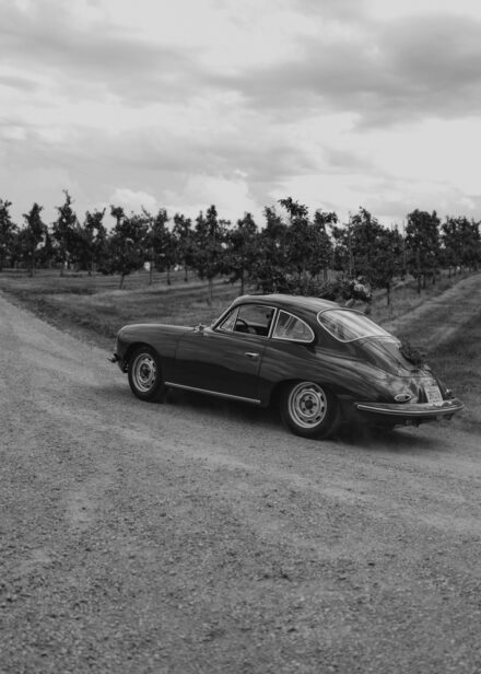 The couple drives away in their Porsche 356.