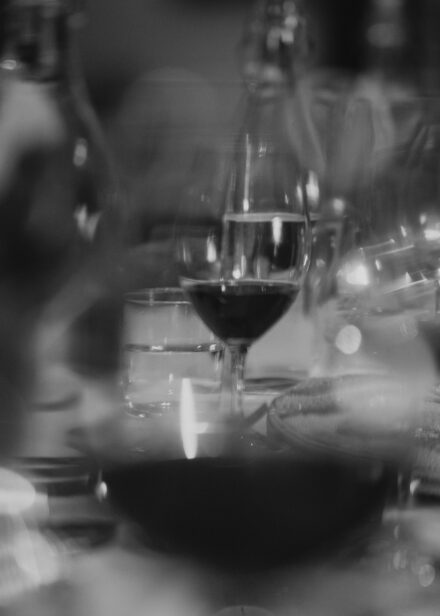 An image of the tablescape taken through the bowl of a wine glass.