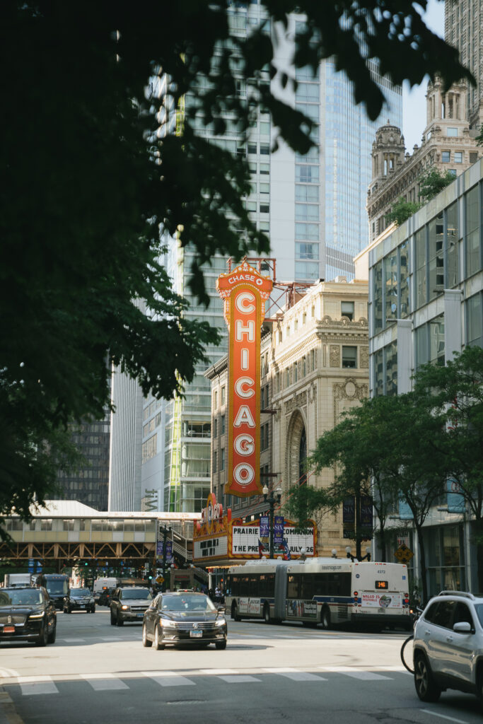 The Chicago Theater sign visible between tree branches.