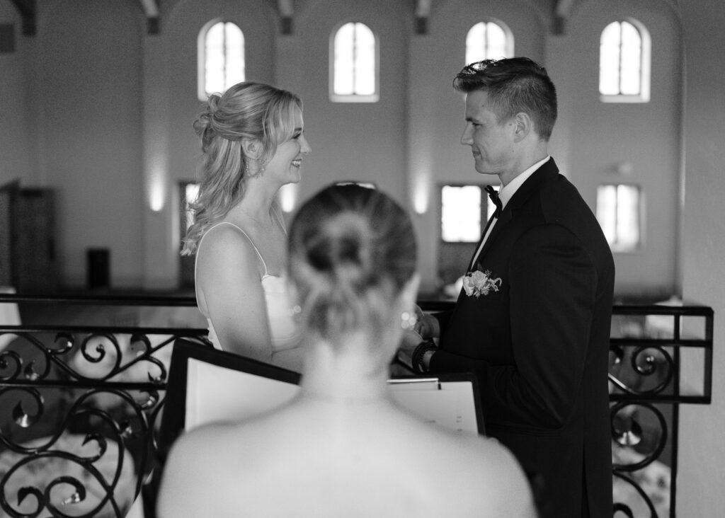 The couple officially gets married in a private ceremony on the walkway overlooking the reception hall.