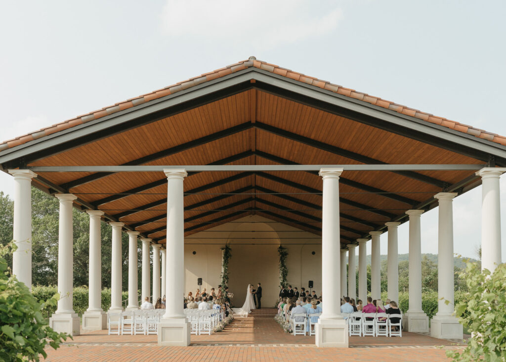 A wide angle shot of the vineyard pavilion during the wedding ceremony.