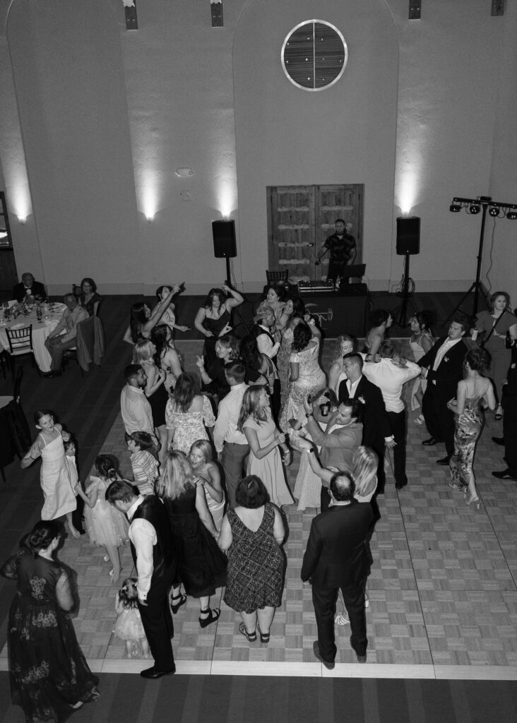 A photo of guests dancing on the dance floor, taken from above.